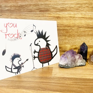 Rock Jede Gelegenheit Karte. Dinosaurier Musik Spaß Sie Rock Karte.   Niedliche Dinosaurier Rockmusik Karte. Musik-Liebhaber-Karte.