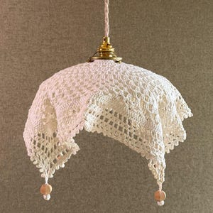 May include: A handmade wooden sign, painted white with a distressed finish, displaying the text "Welcome to our home" in a cursive font. It features a floral design and is intended for wall hanging.