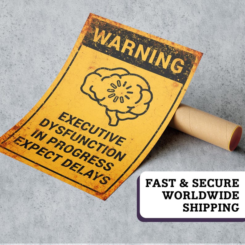May include: A yellow metal sign with the text "WARNING" at the top and "EXECUTIVE DYSFUNCTION IN PROGRESS EXPECT DELAYS" below a brain graphic. The sign has a distressed, aged appearance. A brown cardboard tube rests beside the sign.