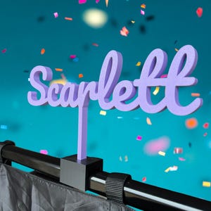 May include: A white ceramic mug with a black handle and the text "But First, Coffee" in a handwritten style. The mug is on a white surface. The mug is approximately 4 inches tall.