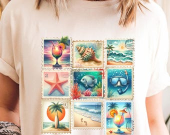 May include: Cream-colored t-shirt featuring a collection of colorful postage stamp designs. The stamps depict tropical scenes, including cocktails, seashells, starfish, fish, beaches, and snorkeling gear. The overall theme is summer and vacation.