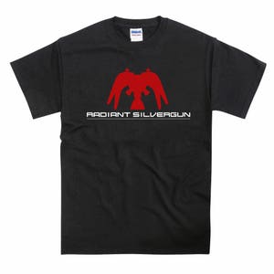 May include: Black t-shirt with a red graphic of a stylized bird with the text "RADIANT SILVERGUN" in white.