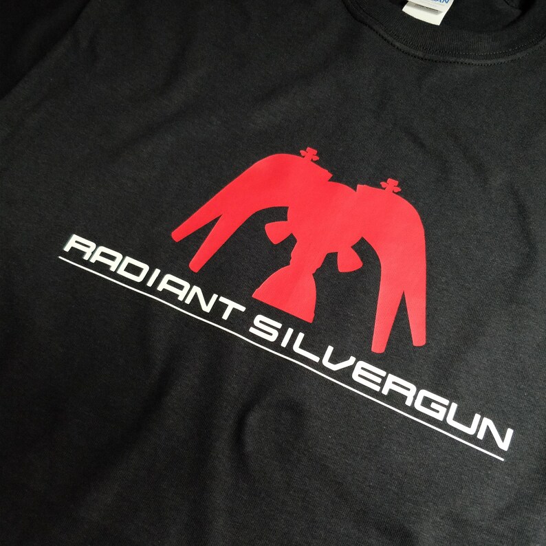 May include: Black t-shirt with a red graphic of a stylized eagle with the text "RADIANT SILVERGUN" in white.