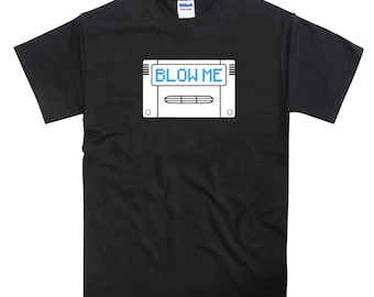 May include: Black t-shirt with a white graphic of a video game cartridge with the text "BLOW ME" on the screen.