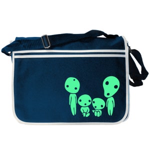 May include: A dark blue canvas messenger bag with a white trim. The bag features a green silhouette of four characters from the animated film 'My Neighbor Totoro'.