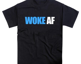 May include: Black t-shirt with the text "WOKE AF" in blue and white block letters. The shirt has short sleeves and a crew neck. The text is centered on the front of the shirt.