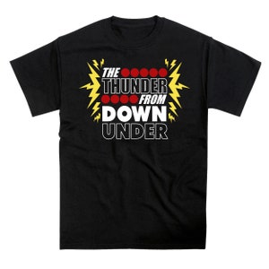May include: Black t-shirt with a white graphic that says "THE THUNDER FROM DOWN UNDER" with red circles and yellow lightning bolts.