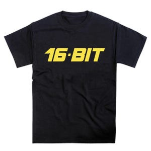 May include: Black t-shirt with a yellow "16-BIT" graphic on the front.