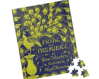 May include: A blue and yellow jigsaw puzzle featuring the cover art of the book "Pride and Prejudice" by Jane Austen, illustrated by Hugh Thomson. The cover art features a peacock with its tail feathers spread out.