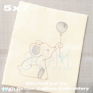 May include: A 5x7 inch embroidery design of a gray elephant holding a balloon. The design is stitched out by High Cotton Custom Embroidery.
