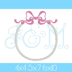 May include: A monogram embroidery design featuring a pearl circle with a pink bow on top. The letters "J & M" are in a script font inside the circle. The design is available in 4x4, 5x7, 6x10 hoop sizes.