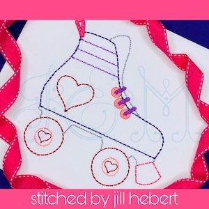 May include: A white background with a pink and purple roller skate with hearts on the wheels and a heart on the skate. The text "stitched by jill hebert" is at the bottom of the image.