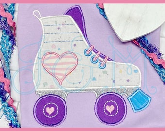May include: Purple and white embroidered roller skate with a pink and white striped heart on the side. The roller skate has a blue and white wheel and a blue and white stopper.