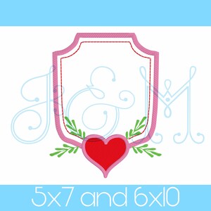 May include: Pink and red embroidery design of a heart with leaves in a shield shape. The design is available in two sizes: 5x7 and 6x10 inches.