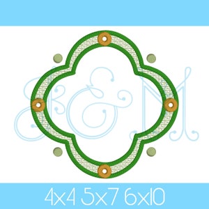 May include: Green and white embroidered frame with a woven texture and gold buttons. The frame is shaped like a four-leaf clover. The text "4x4 5x7 6x10" is below the frame.