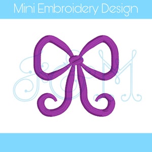 Puede incluir: Un lazo morado con un diseño simple, perfecto para proyectos de bordado.