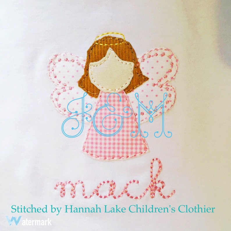 May include: A pink and white gingham angel with brown hair and a halo. The angel is holding a pink and white gingham dress. The name "Mack" is embroidered below the angel.