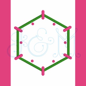 May include: A green hexagonal frame with pink accents and small white dots. The frame is empty, but there are decorative swirls inside the frame.