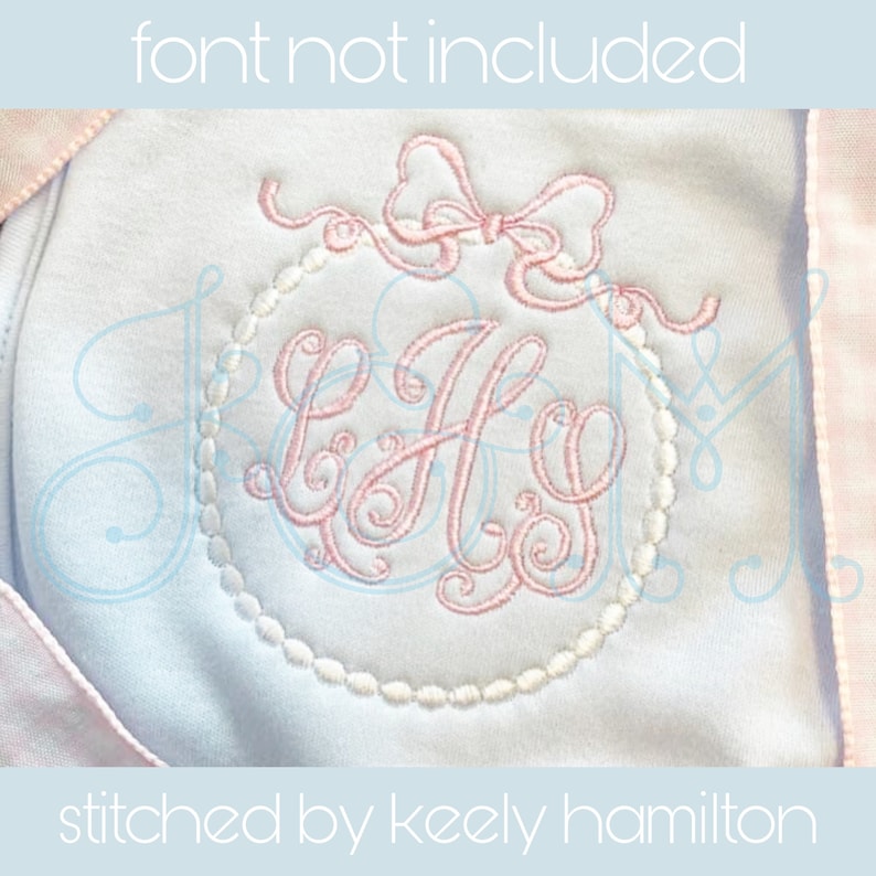 May include: A pink and white embroidered monogram with a bow on a light blue fabric background. The monogram is in a circle with a beaded border. The text "stitched by keely hamilton" is at the bottom of the image.