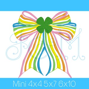 May include: A colorful rainbow striped bow with a green four-leaf clover in the center. The bow is a digital embroidery design available in sizes 4x4, 5x7, 6x10.
