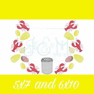 May include: Embroidered design featuring a lobster and lemon motif with the letters J & M in a cursive font. The design includes a small pot with a lid and the text "5x7 and 6x10".
