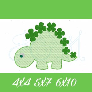 May include: Green embroidered dinosaur with shamrock designs on its back. 4x4, 5x7, 6x10.