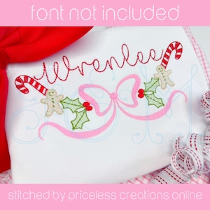 May include: Embroidered design featuring the name "Wrenlee" in a cursive font, with a pink bow, holly leaves, red berries, and gingerbread men holding candy canes. The design is stitched on a white fabric.