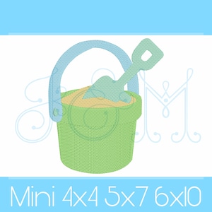 May include: A green plastic bucket with a blue handle and a blue plastic shovel inside. The bucket is filled with tan sand. The image includes the text "Mini 4x4 5x7 6x10".