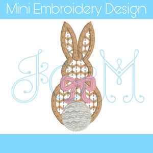 May include: A brown bunny with a pink bow and a gray egg. The bunny is embroidered with a basket weave pattern.