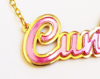 C*nty necklace in pink and gold mirror acrylic, Mature.