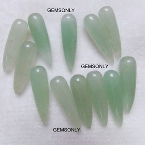 May include: Ten light green, teardrop-shaped gemstone beads. The beads are smooth and polished. GEMSONLY is printed three times on the white background.