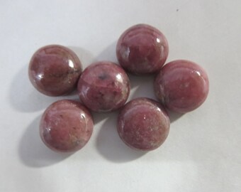 May include: Six round, pink and white, polished gemstone cabochons.
