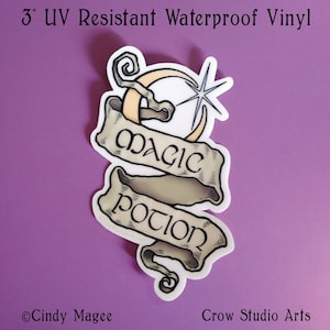 May include: A 3-inch UV resistant waterproof vinyl sticker with a banner design. The banner reads "MAGIC POTION" in a vintage font, with a crescent moon and star graphic. The sticker is white with tan and black accents.