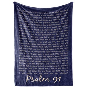 May include: Dark blue throw blanket with the text of Psalm 91 in white script. The blanket has a soft, plush texture, designed for comfort and warmth. A cosy addition to any home.