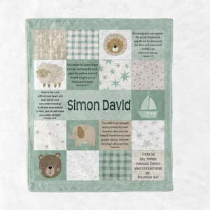 May include: A baby blanket with a patchwork design in shades of green and white. The blanket features illustrations of a lion, sheep, bear, elephant, and sailboat. The name "Simon David" is printed in the center, along with inspirational quotes.