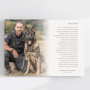 May include: A memorial photograph featuring a man in a tactical vest and a German Shepherd dog. The dog is tan and black. Text on the right side reads "End of Watch" and a poem, "In Memory of Kojak, EOW 12-7-2025."
