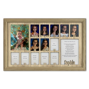 May include: A wooden picture frame with 12 openings for photos. The frame has a light brown wood finish and includes a personalised nameplate with the name "Sophia". The frame is designed to hold photos from each year of a child's school life, from preschool to 5th grade. The frame also includes inspirational quotes for each grade level.