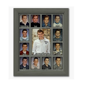 May include: A gray picture frame with a collage of photos of a boy from kindergarten through 12th grade. The frame has a silver plaque with the name "Landen" on it.