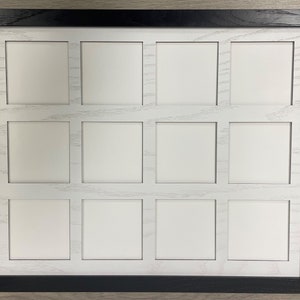 May include: A black picture frame with a white mat and 12 openings for photos. The frame is made of wood and has a simple design.