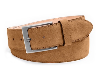 May include: A tan suede belt featuring a rectangular brushed silver metal buckle and a matching suede keeper loop. The belt strap has a smooth light beige interior lining and visible adjustment holes along the side of the textured brown surface.