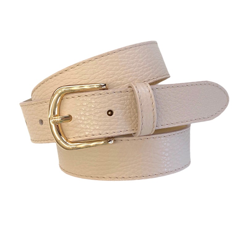 May include: A light beige leather belt with a gold buckle. The belt is rolled up and the buckle is visible.