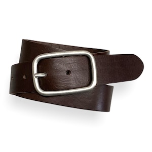 May include: A brown leather belt with a silver rectangular buckle.