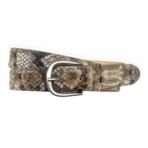 May include: A brown snakeskin belt with a silver buckle.