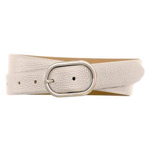 May include: A metallic silver belt with a textured, pebbled surface finish. The belt features a simple, oval-shaped metal buckle in a muted silver tone. The strap has visible adjustment holes and a smooth, tan-coloured interior lining.