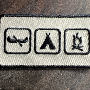 Camping embroidered patch featuring canoe tent campfire camping merit badge