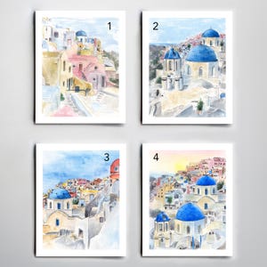 May include: Four watercolor paintings of a Greek island village with white buildings and blue domed churches. The paintings are numbered 1 through 4.