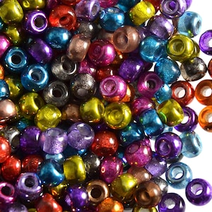 May include: A large pile of colourful iridescent glass beads. The beads are round and have a hole in the centre. They are perfect for jewellery making or other craft projects.