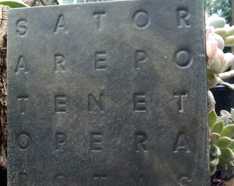 May include: A dark green square plaque with the Latin phrase "SATOR AREPO TENET OPERA ROTAS" engraved in a grid pattern.