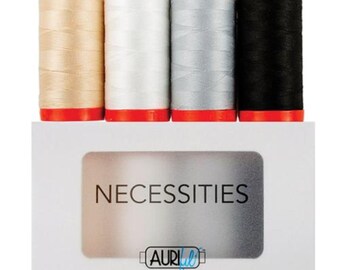 May include: A set of four spools of Aurifil thread in a white box. The spools are beige, white, silver, and black. The box has the word "Necessities" printed on it.
