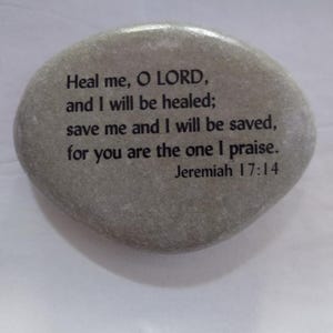 May include: A gray stone with the text "Heal me, O LORD, and I will be healed; save me and I will be saved, for you are the one I praise. Jeremiah 17:14" printed on it.
